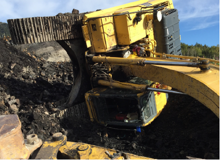 [Image] yellow excavator tipped on side. 