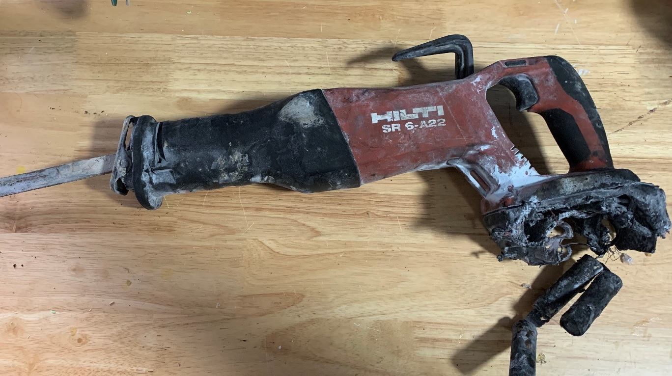 [image] sabre saw with melted battery