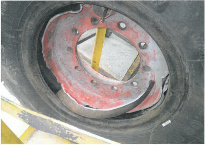 [image] close-up view of tyre, showing rim damage