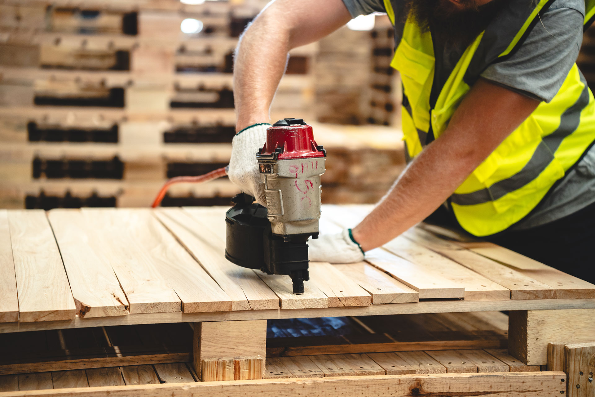 [image] Worker drilling - wood product manufacturing