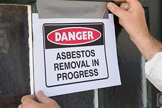 [image] Asbestos removal in progress sign
