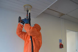 [image] Worker standing with shroud