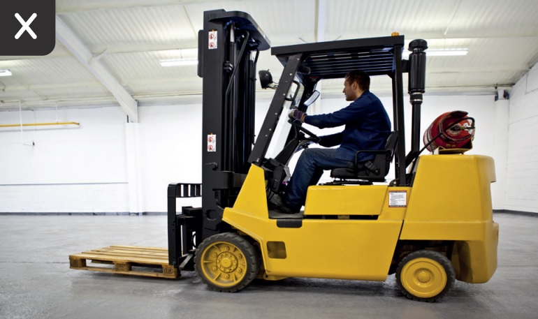 [image] photo of a worker driving an LPG forklift in a poorly ventilated area with a cross to show this is unsafe