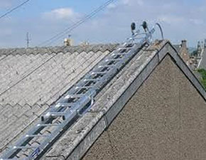 [image] Roof ladders attached to an asbestos roof