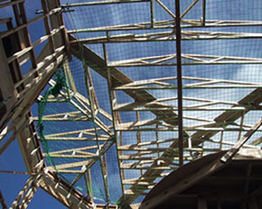 [image] Safety nets set up under a roofing construction