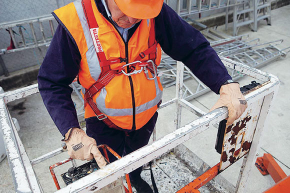 [image] A worker restrained in a boom style elevating work platform