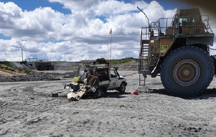 [Image] Dump truck beside a crushed tray of a light vehicle. 