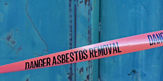 [image] Barricade tape at asbestos removal site