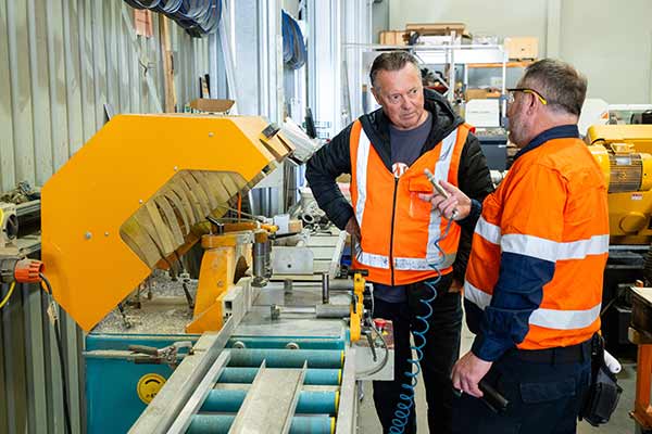 [image] Inspector having a safety discussion with worker